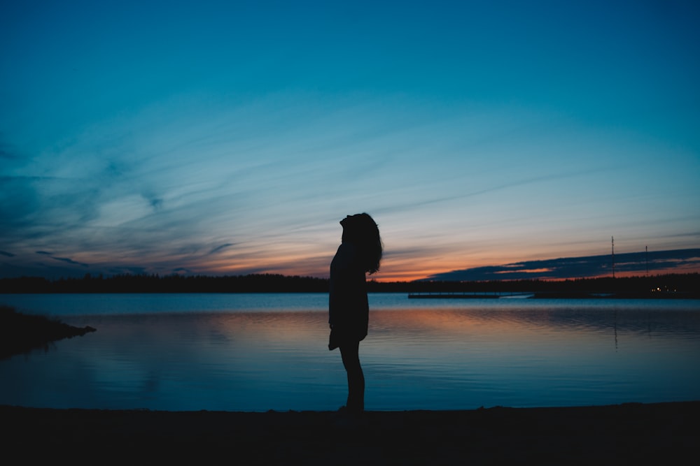 woman standing on shore