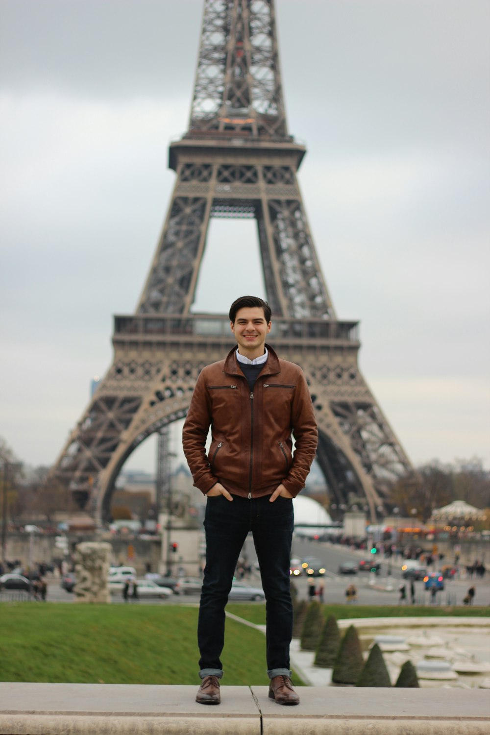 man standing near Eiffel tower
