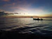 silhouette of people riding canoe boat