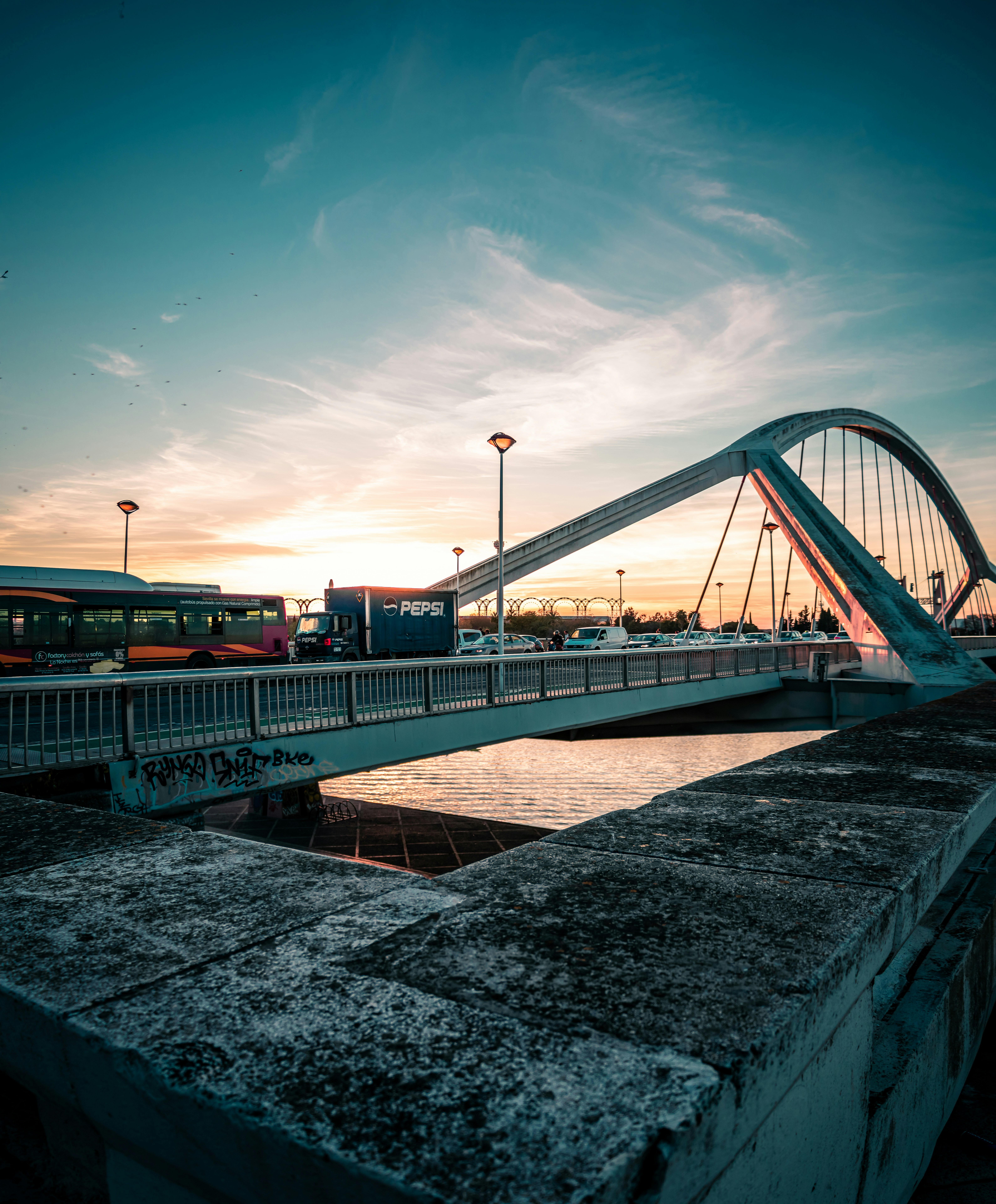 Infront of a beautiful composition of the Barqueta's bridge, in Sevilla during the Golden Hour