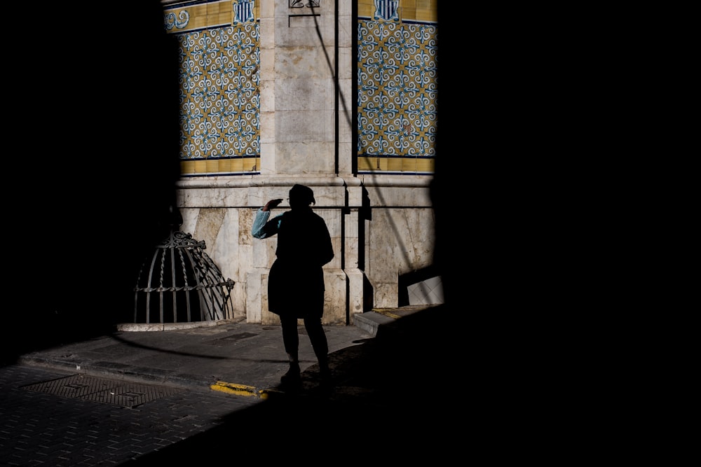 woman standing near wall