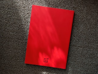 1+ box on gray textile