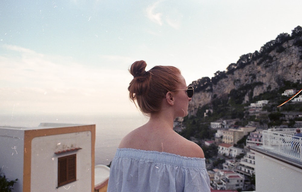 woman seeing buildings on high ground