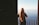 woman standing near steel balustrade