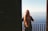 woman standing near steel balustrade