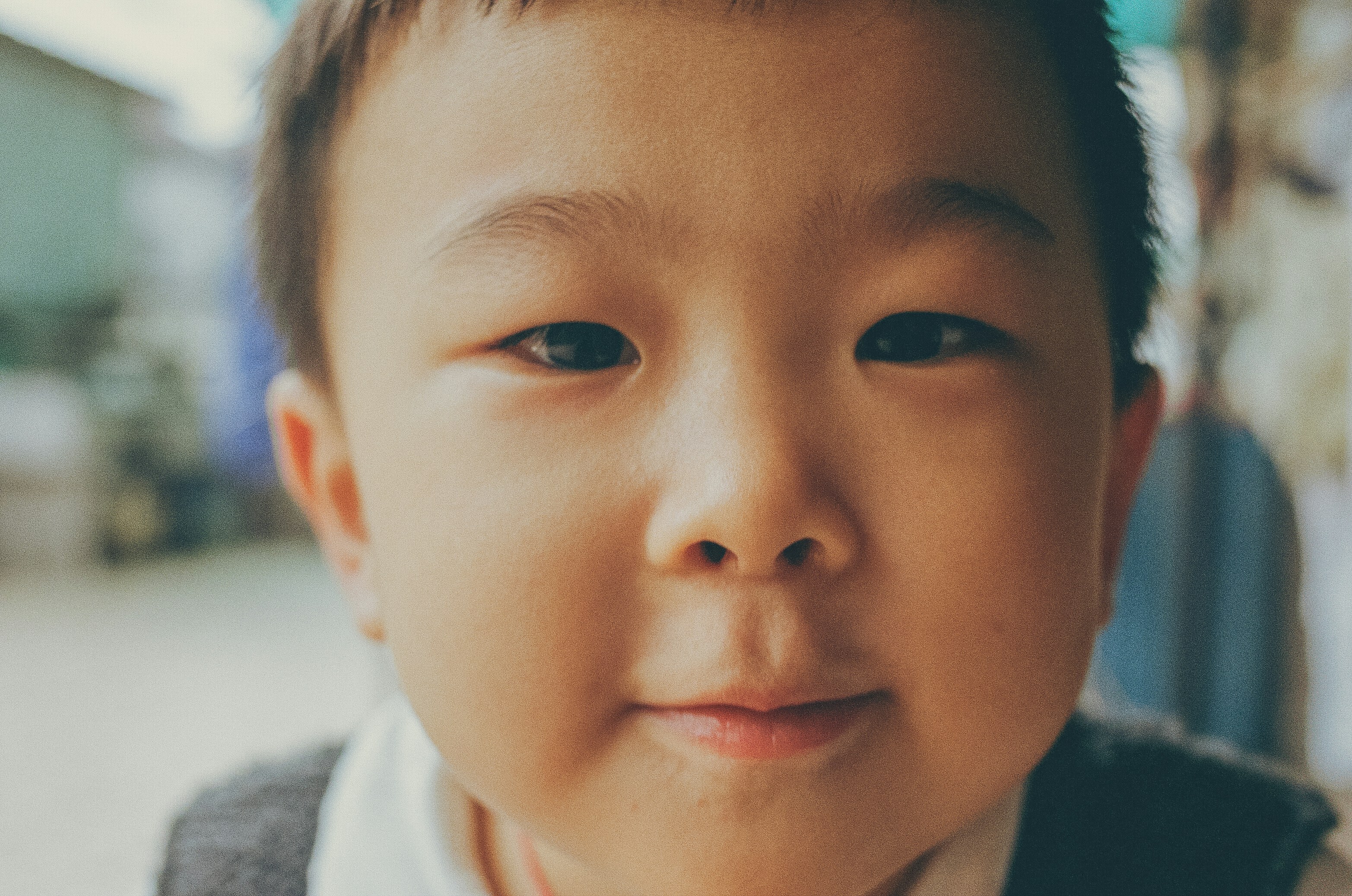 boy in white and gray top