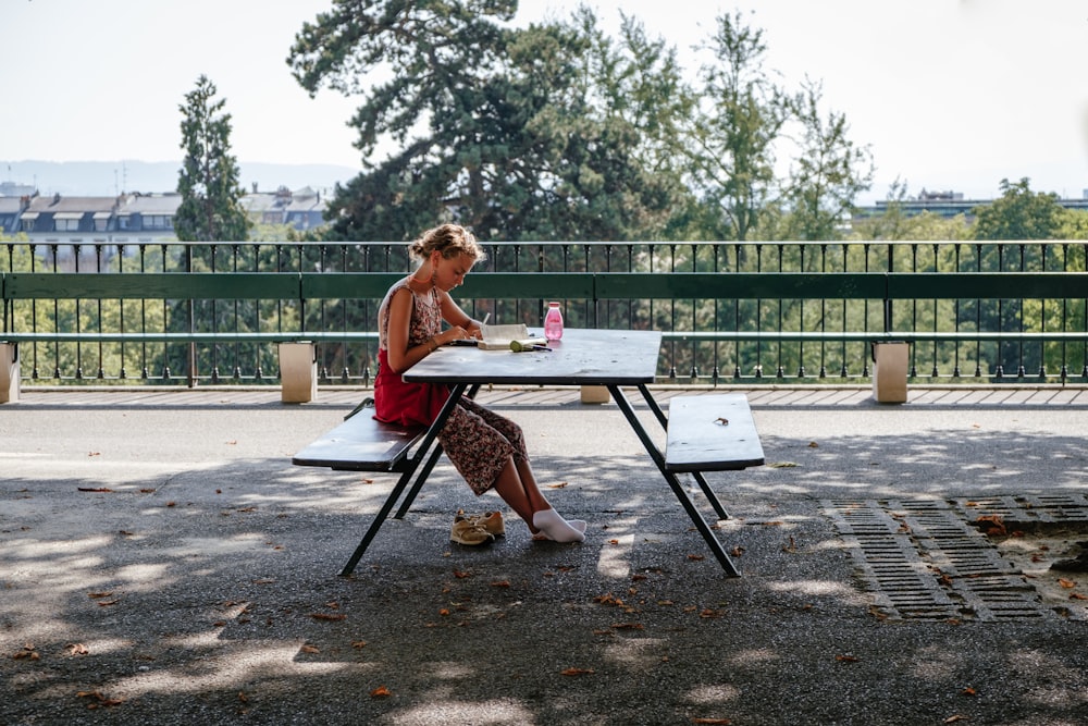 girl sitting at bench