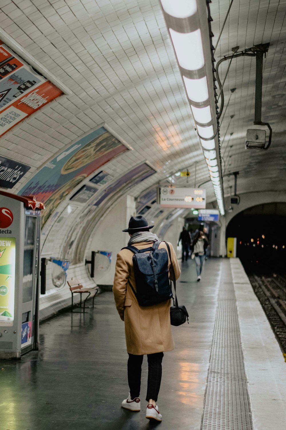 man walking near railway