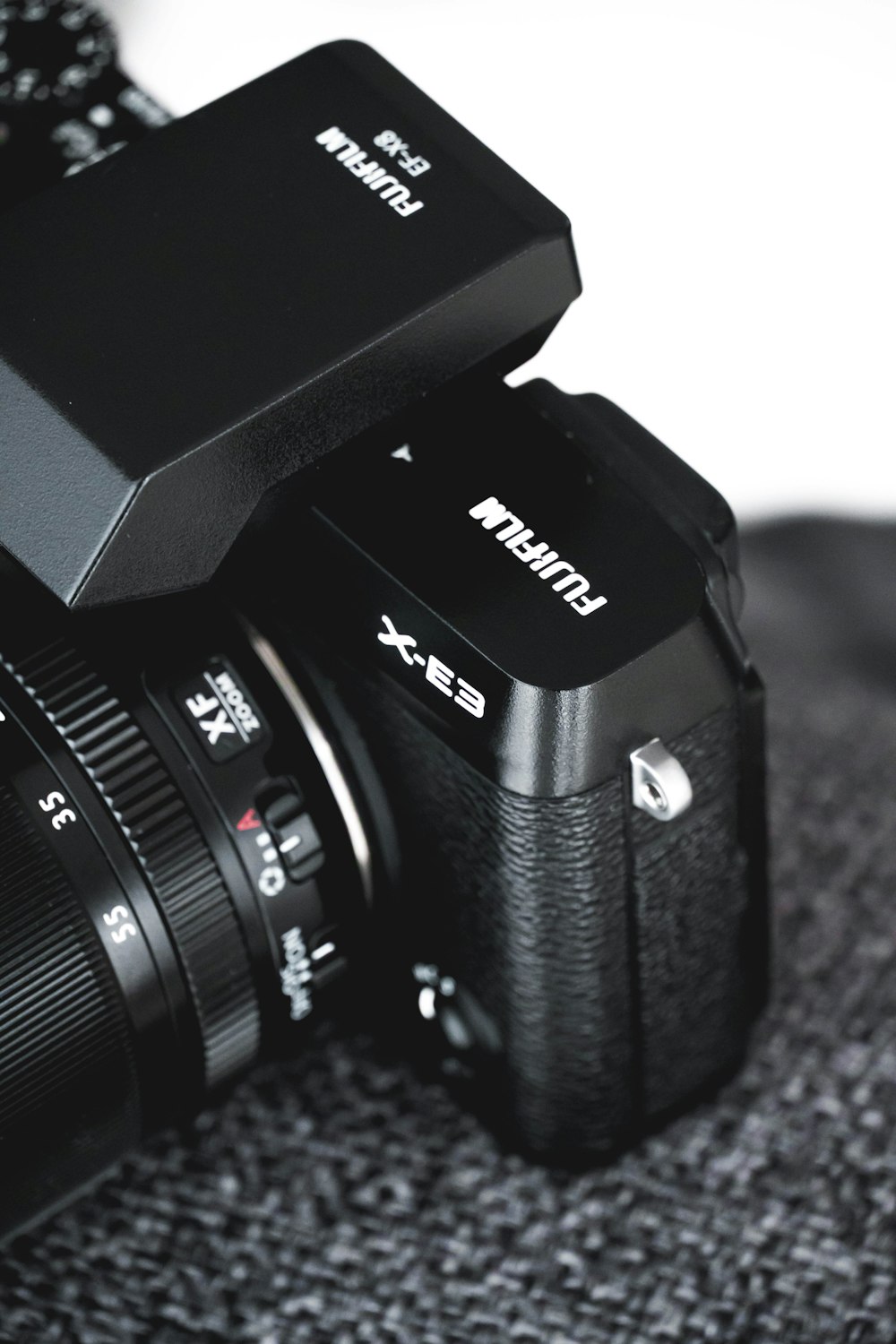 shallow focus photo of black Fujifilm DSLR camera