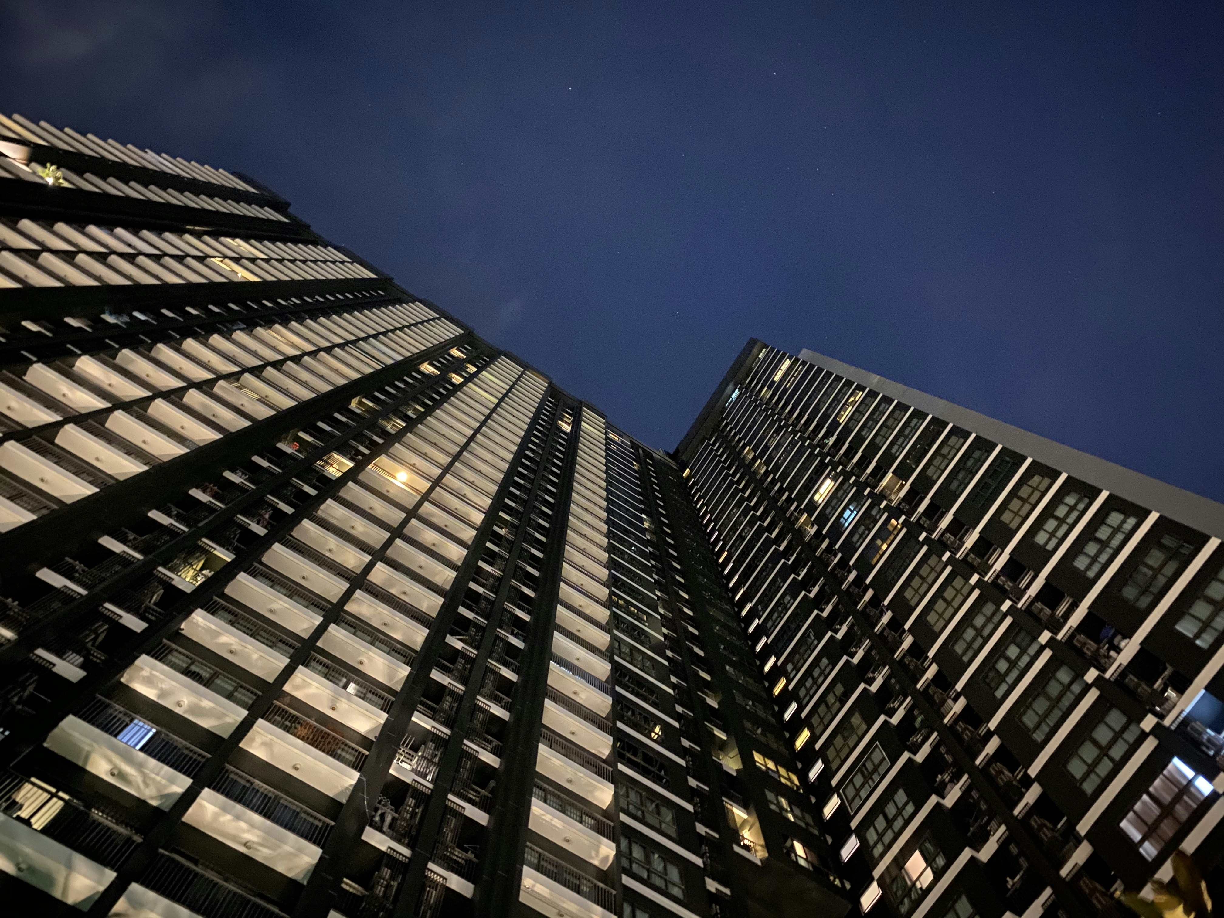 worm view photo of black building during daytime