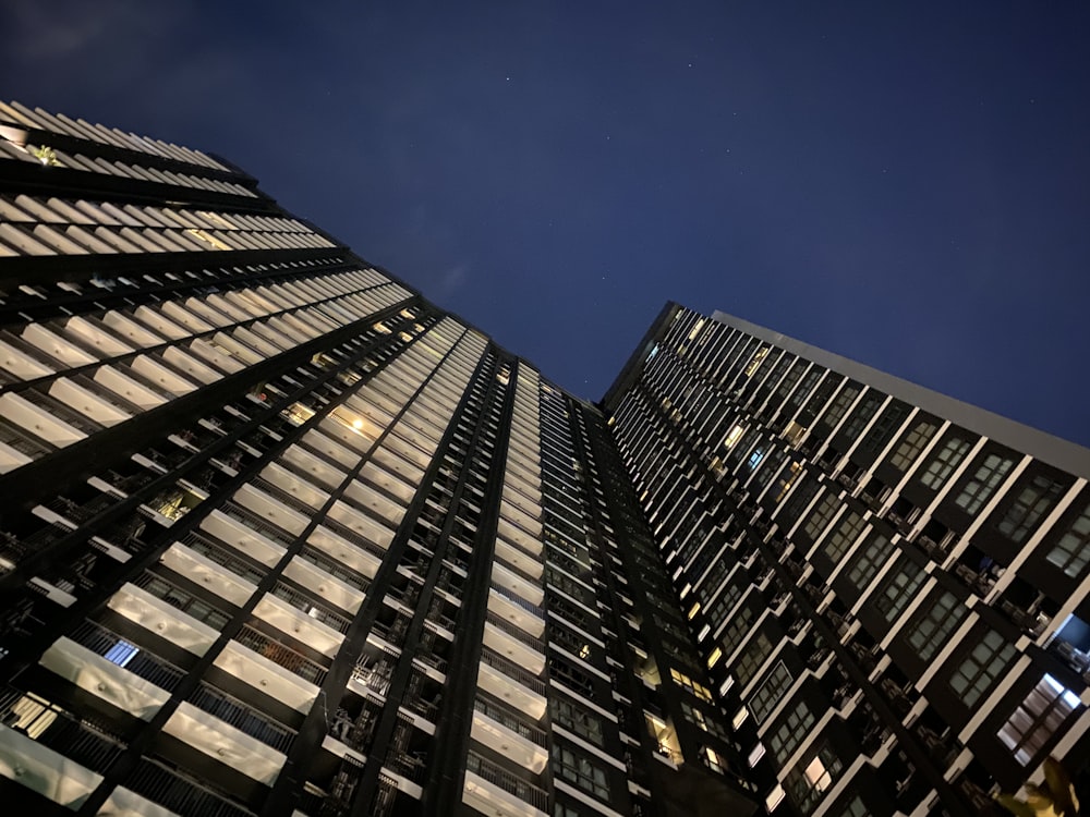 worm view photo of black building during daytime