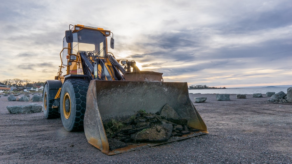 shallow focus photo of yellow front loader