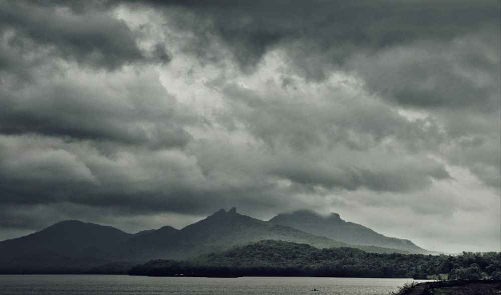 mountain under cloudy sky