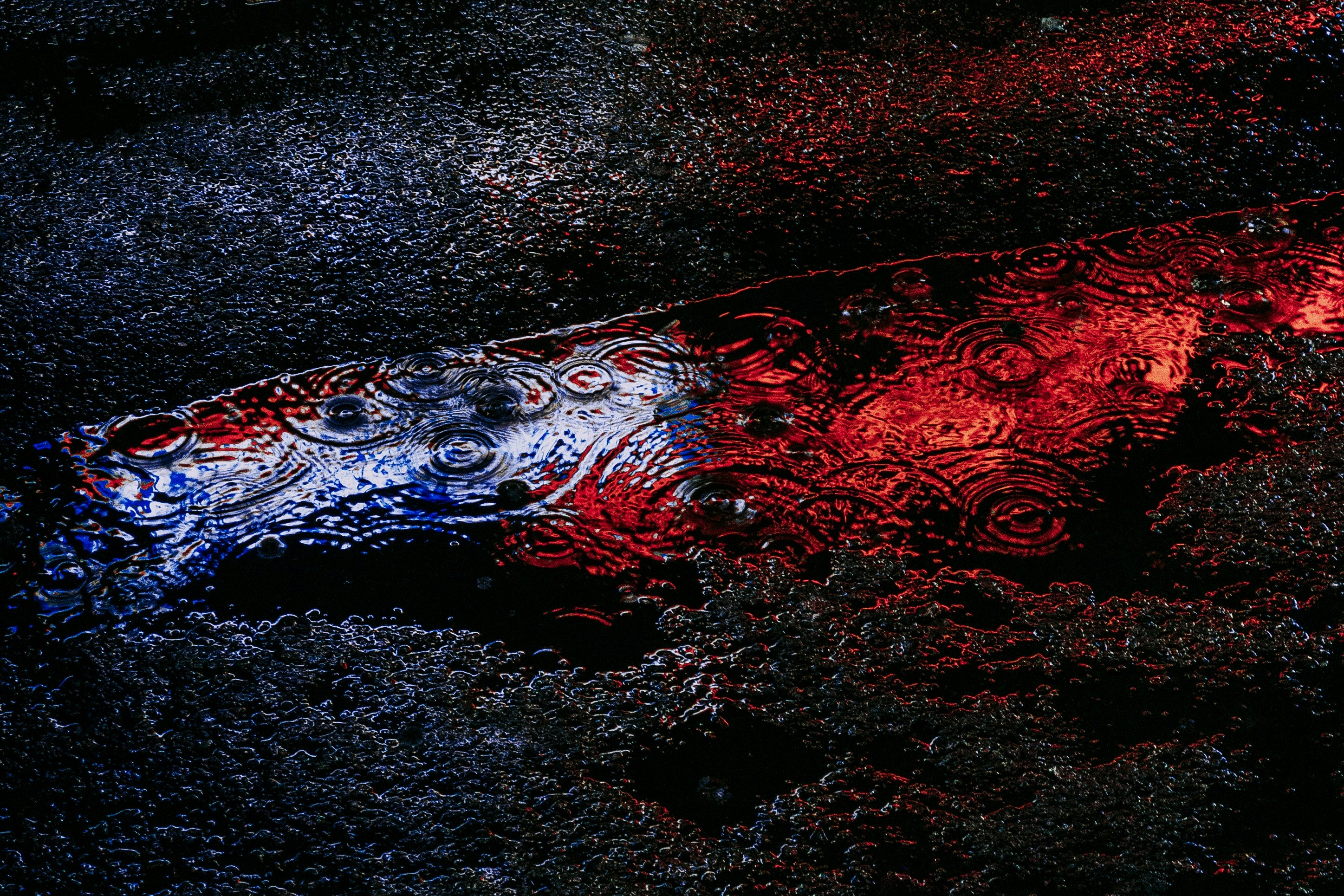 blue and red light reflection on water
