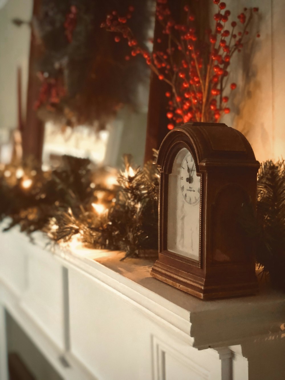 brown and white analog clock on wall rack