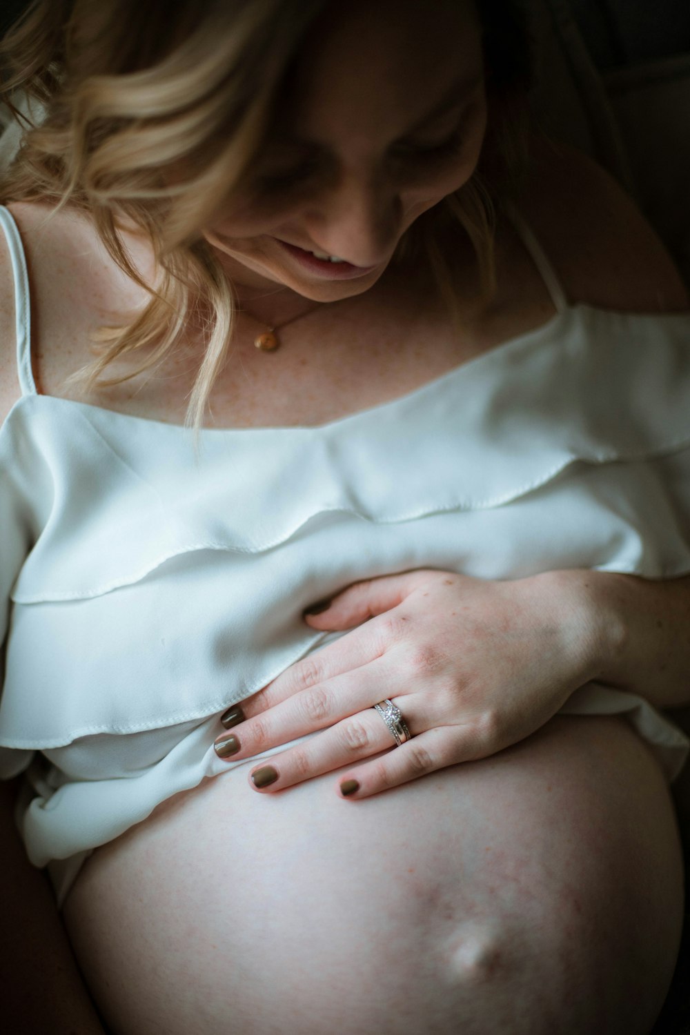 pregnant woman wearing blue camisole