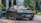 Close-up of a shiny black SUV with a spotless finish parked on a clean driveway.
