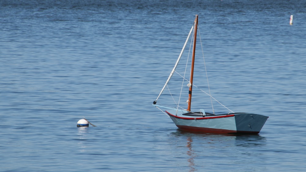 blue boat on ocean