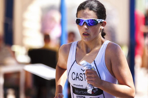 Athlete wearing sleek, lightweight sports glasses during a fast-paced run.
