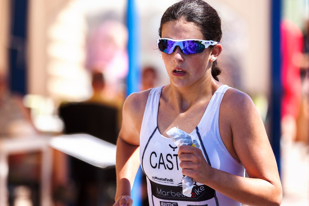 cyperus, runners, woman wearing blue-lens sunglasses and white tank top