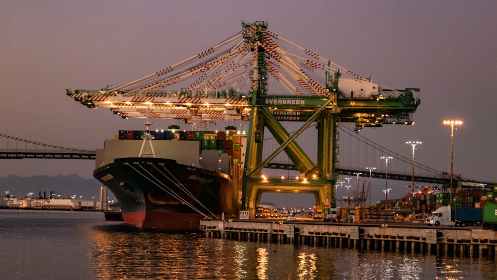 cruise ship beside dock during nighttime