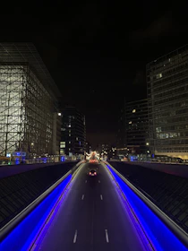 Night shot of LED street lighting illuminating a busy urban road.