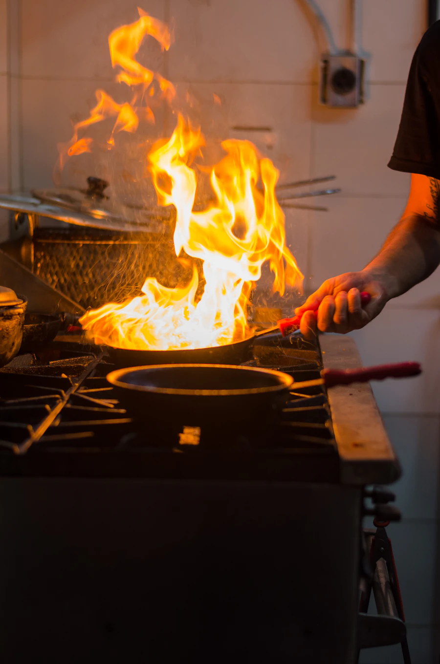 Flames leaping from a wok