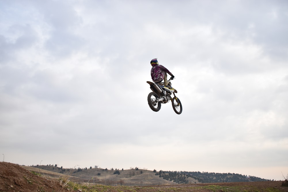 man riding pitbike during daytime