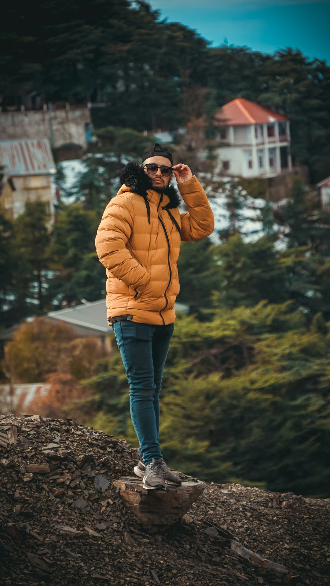 man standing on mountain during day