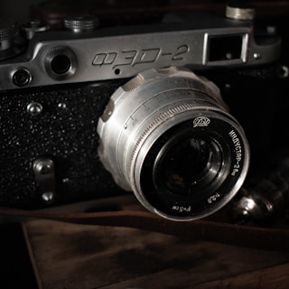 Close-up of a vintage film camera with detailed mechanical parts.