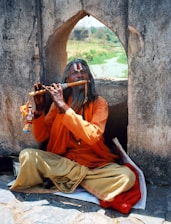 man using flute