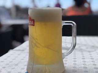 A cold beer at a lively, friendly sports bar, with a historic vibe.