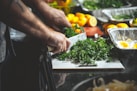 person slicing parsleys