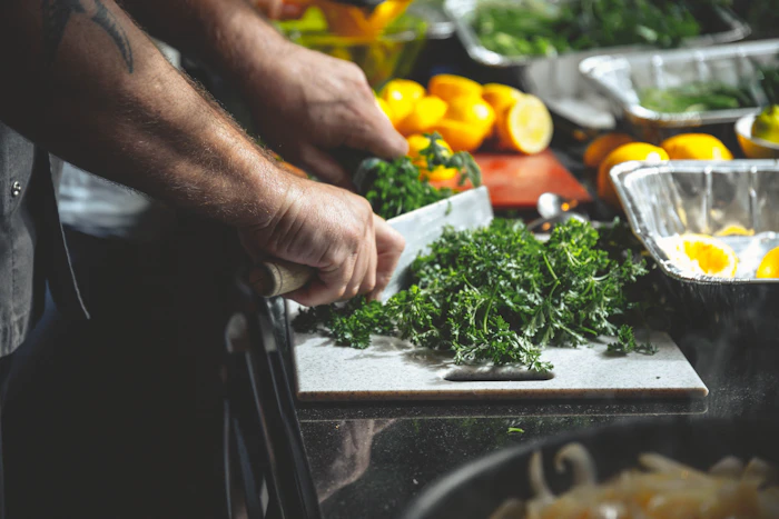 Slicing fresh parsley on a board