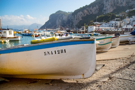 boats on shore in Capri Italy