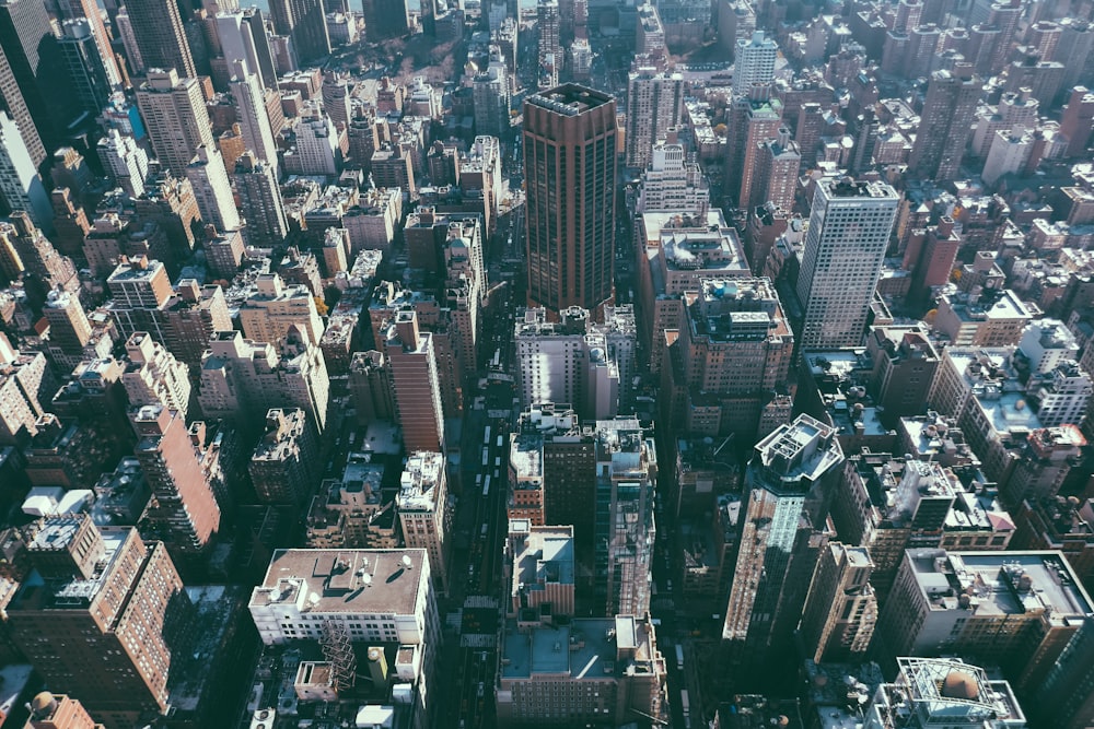 an aerial view of a city with tall buildings