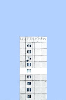 Exterior view of the Serverwal data center building with a clean, minimalist white and blue facade.