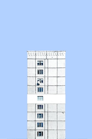 Exterior view of the Serverwal data center building with a clean, minimalist white and blue facade.