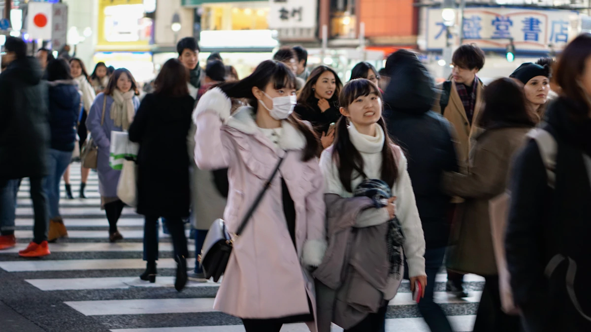 Pedestrians crossing the famous scramble crossing in Shibuya, Tokyo