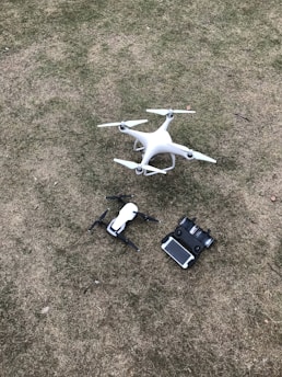 white DJI Mavic Pro drone set on grass