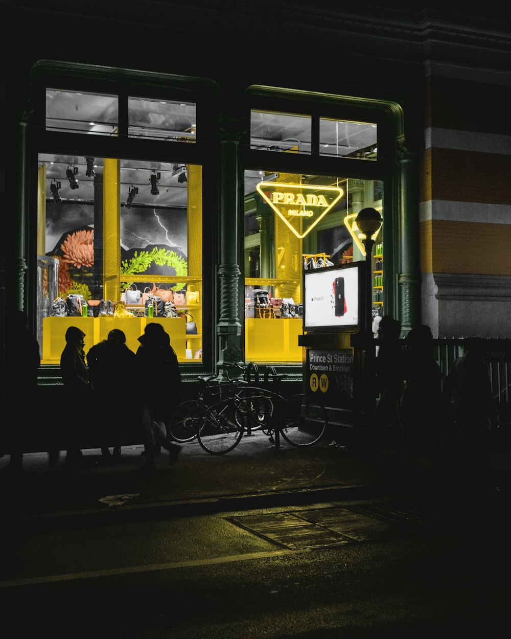 silhouette of people standing near store