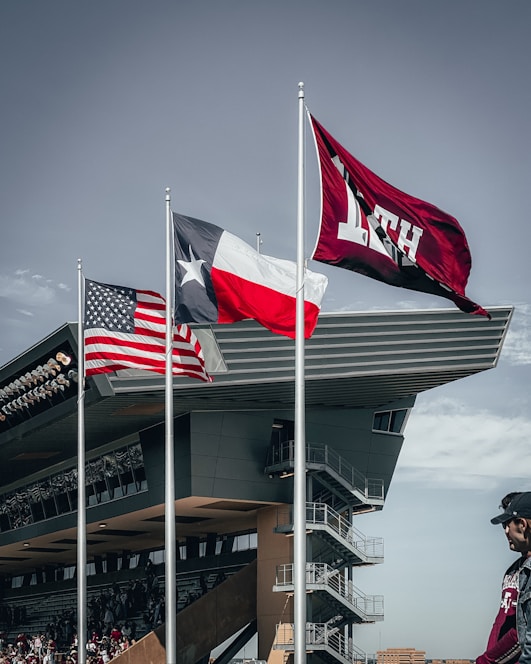 Portrait of Craig S. Goralski standing confidently with the Texas flag in the background.