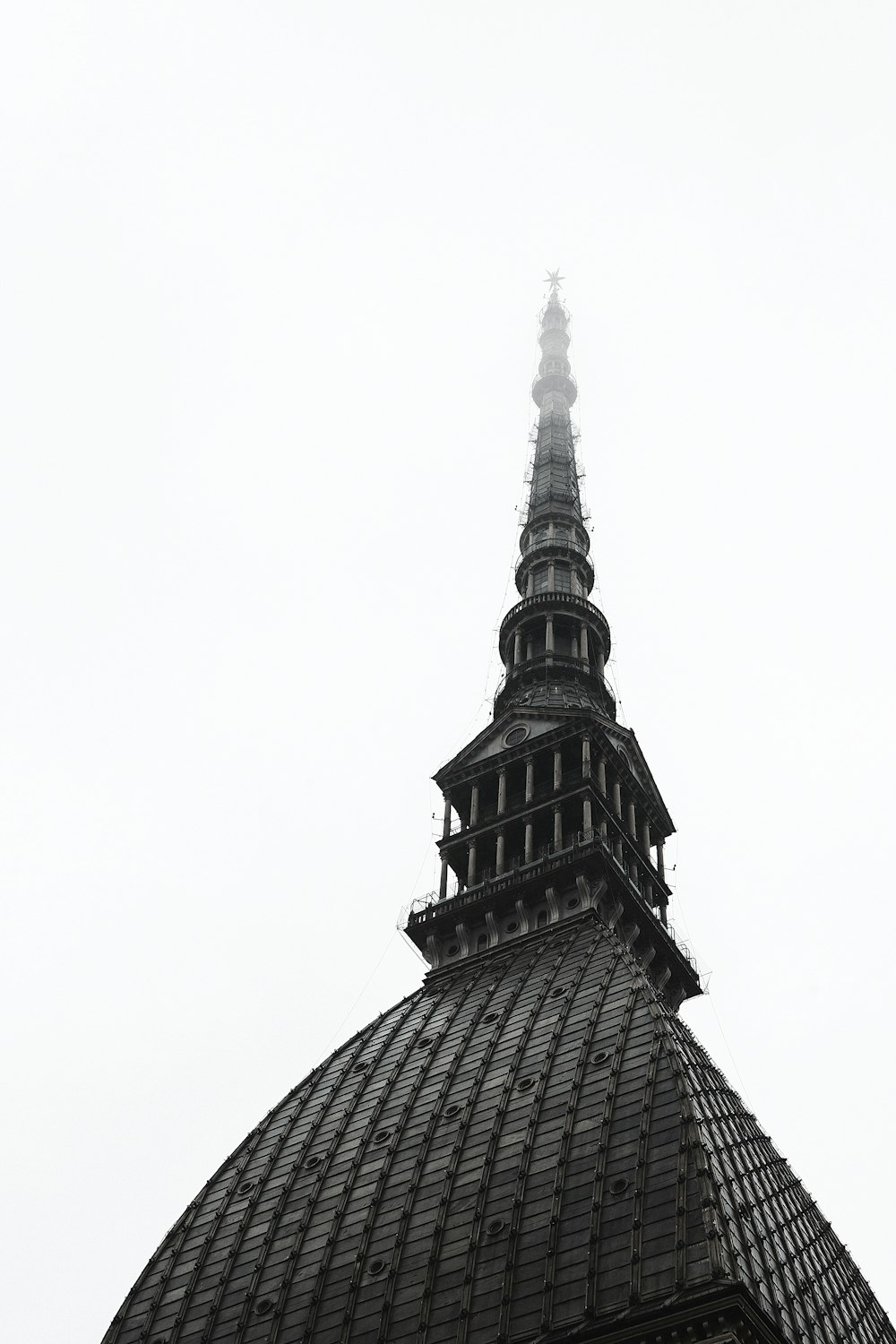 a very tall building with a clock on it's side