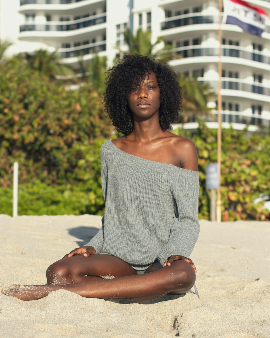 woman sitting on sand