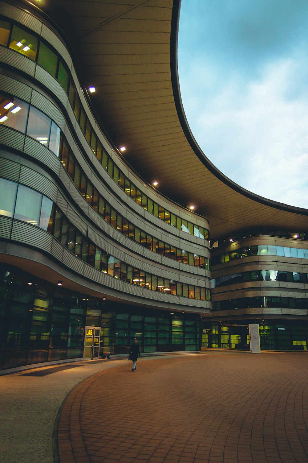 a circular building with a sky background