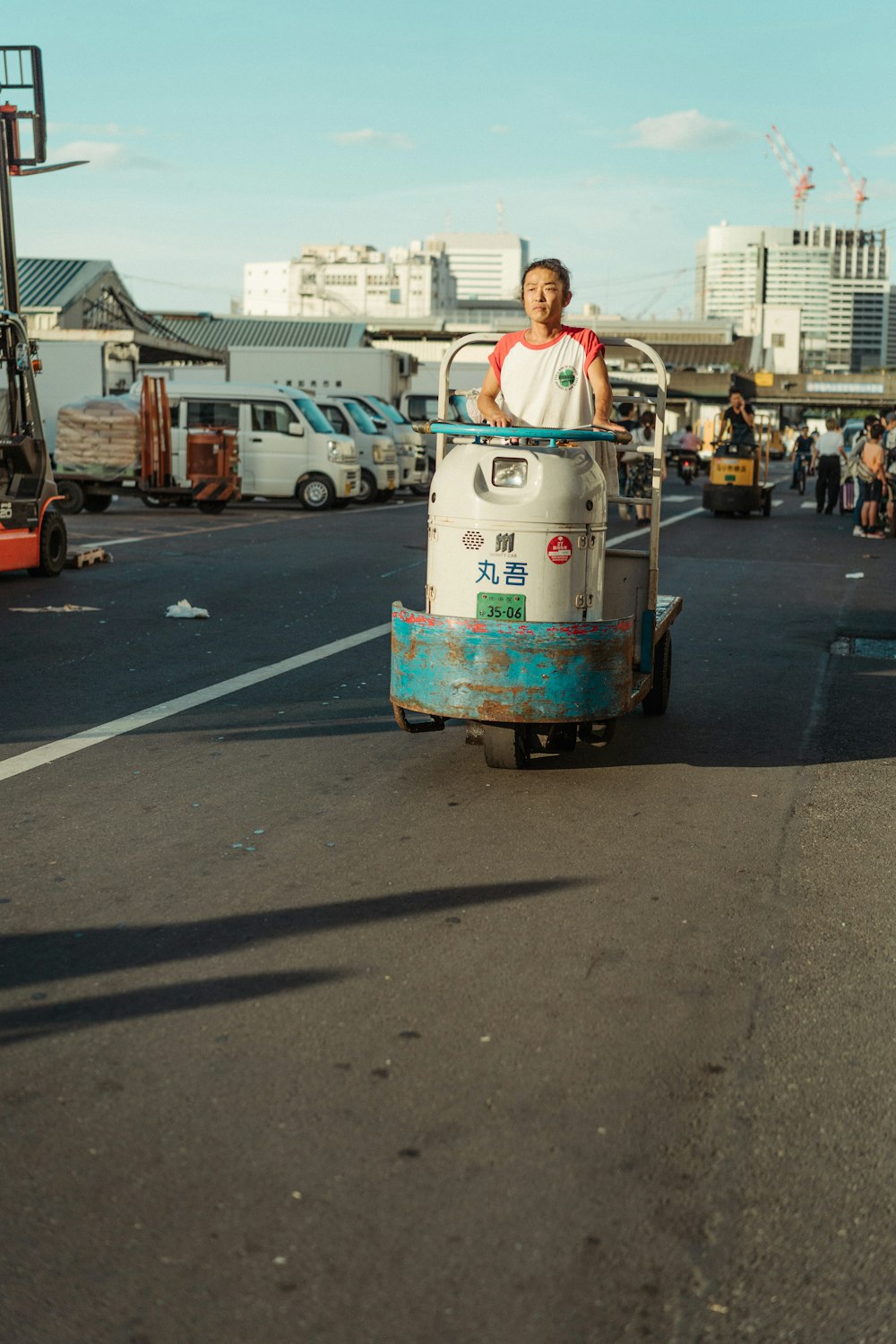 woman on cart on road