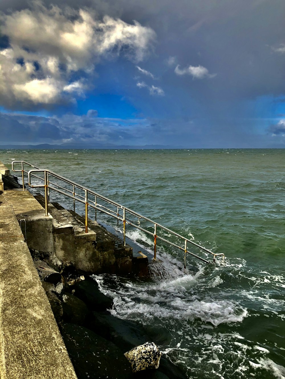 stairs on shore during daytime