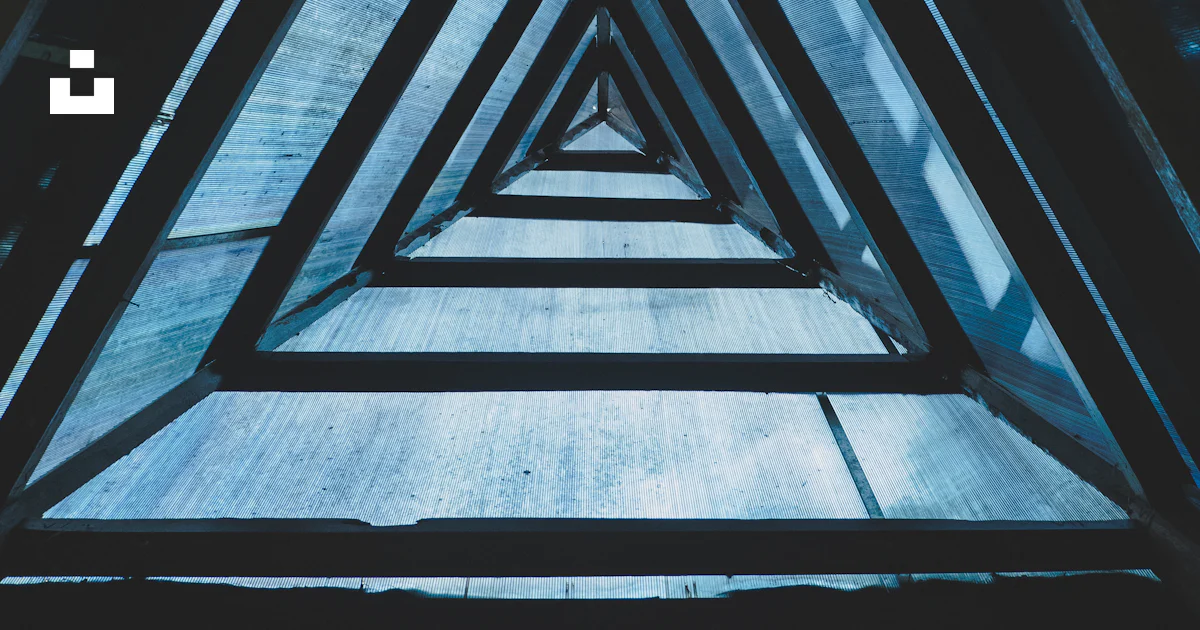 Trriangular Window Pattern A group of triangular shaped windows in a building photo – Free East ...
