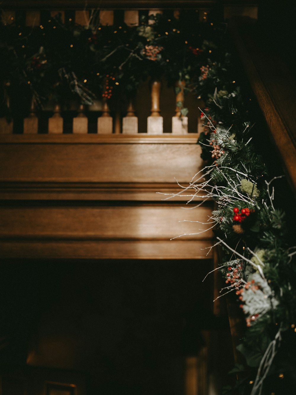 brown wooden stairs with Christmas garland