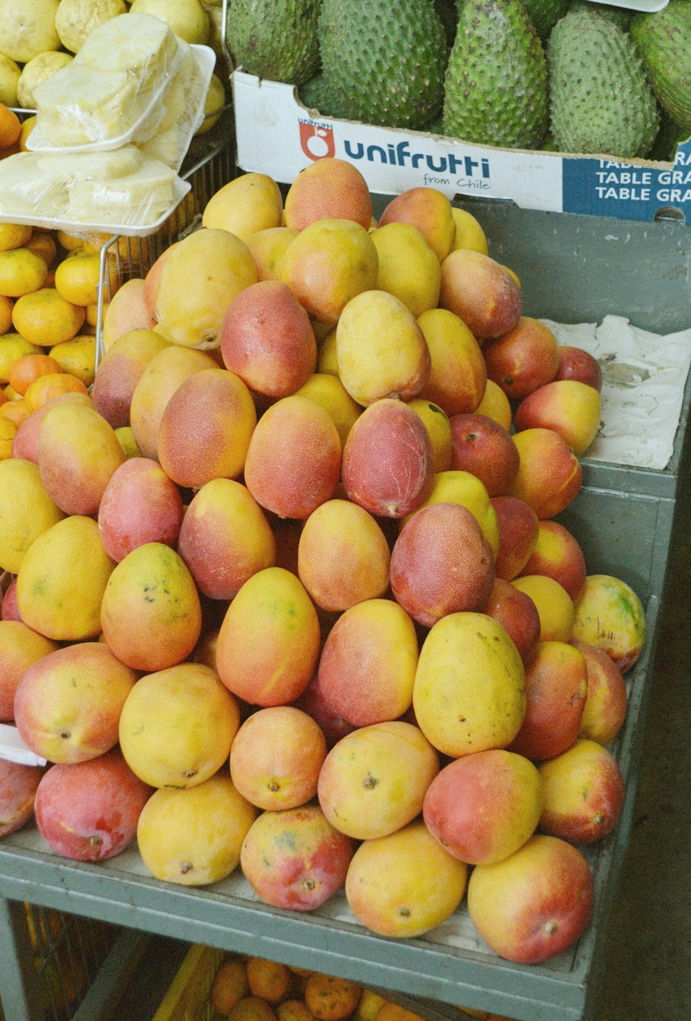 red apple fruits display during daytime